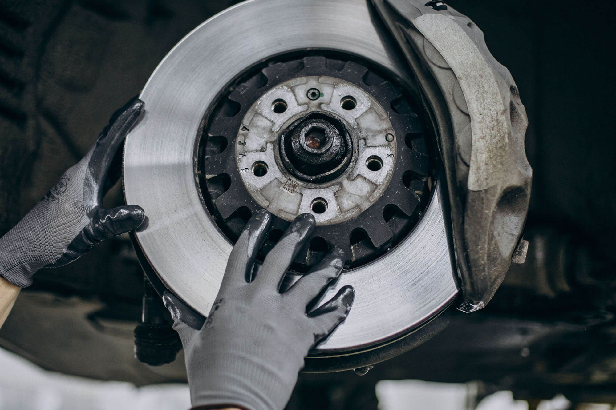 Mechanic Changing Discs Brakes Car Service